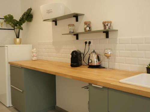 a kitchen with a counter with a blender on it at L'HERMANCERIE in Priay