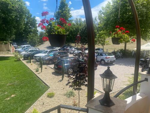 a view of a parking lot with cars parked at Tanyacsárda Panzió in Baja