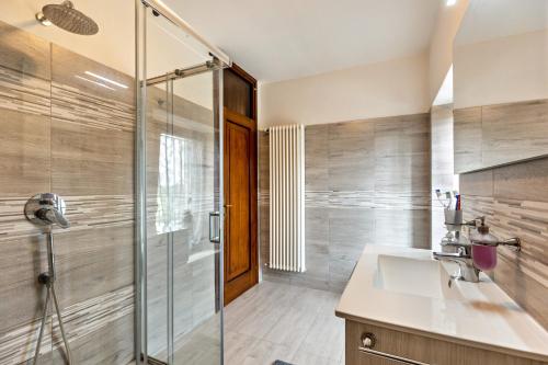a bathroom with a sink and a shower at Cascina Raperonzolo in Lonato del Garda