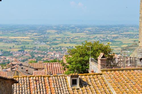 a view of a town from the roof of a building at Hotel San Michele in Cortona