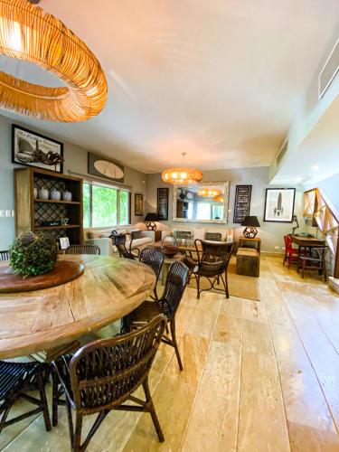 a living room with a table and chairs at Xeliter Balcones del Atlantico - Las Terrenas in Las Terrenas