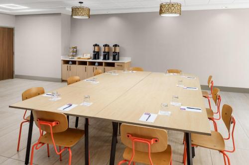 a large conference room with a large table and chairs at Hyatt Place across from Universal Orlando Resort in Orlando