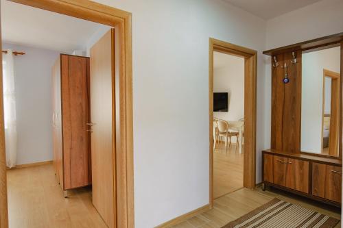 an empty room with a door and a mirror at Villa All Season in Sarandë