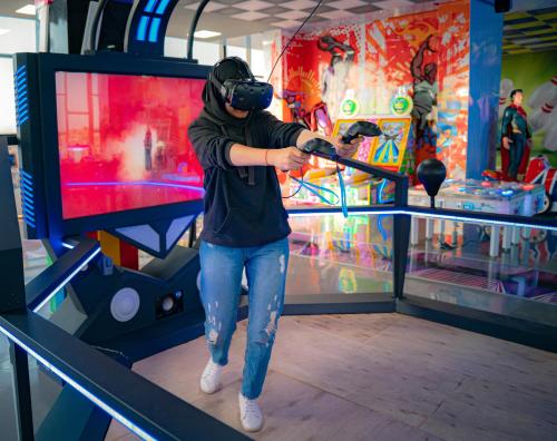 a man wearing a mask swinging a baseball bat at a game at Waves Aqua Resort in Kenitra