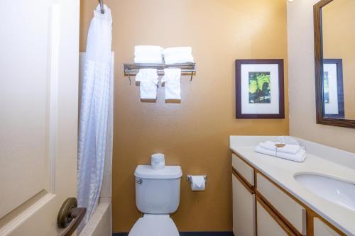 a bathroom with a toilet and a sink at Admiral Suites - Annapolis in Annapolis