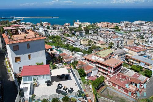 an aerial view of a city with the ocean at Victory's Luxury House with Jacuzzi on the Roof in Ischia