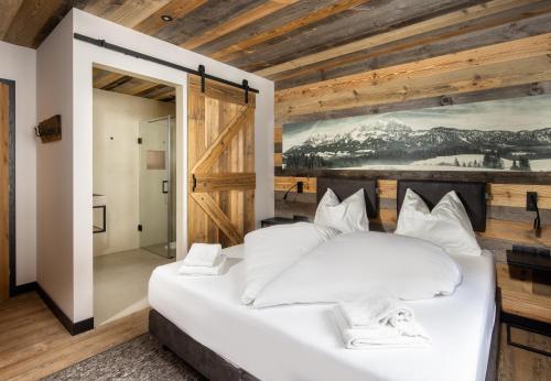 Alm-Lodges Montafon by Pferd auf Wolkeにあるベッド