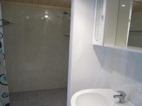 a bathroom with a toilet and a sink and a shower at Appartamento Pineta in Grado