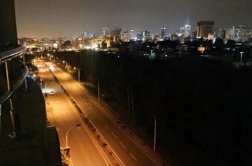 a view of a city at night with lights at Emeli Suites in Nairobi