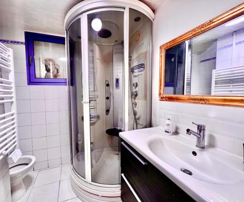 a bathroom with a sink and a shower at La Bastide Bleue in La Ciotat