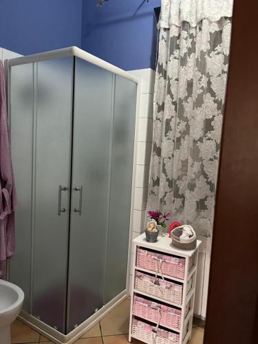 a bathroom with a shower stall and a toilet at Villa Iris in Iglesias