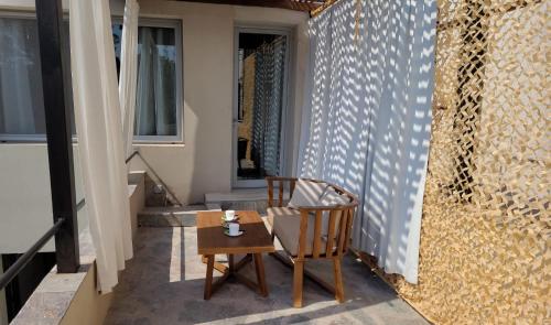 a table and two chairs sitting on a balcony at La Belle San Isidro Lofts in San Isidro