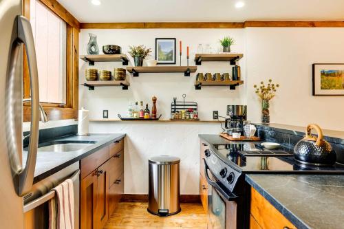 a kitchen with a sink and a stove at Elegant Vail Home - Walk to Booth Falls Trail in Vail