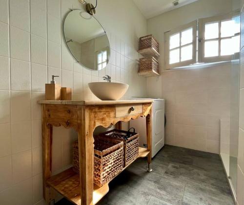 a bathroom with a sink and a mirror at Mamie House coeur Périgord in Siorac-en-Périgord