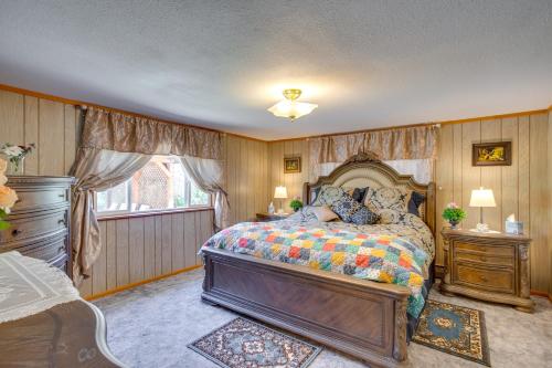 a bedroom with a bed and a window at Sunny Cedaredge Home with Mtn Views - Hike and Fish! in Cedaredge