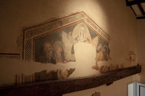 a painting on the wall of a room at Hotel San Michele in Cortona