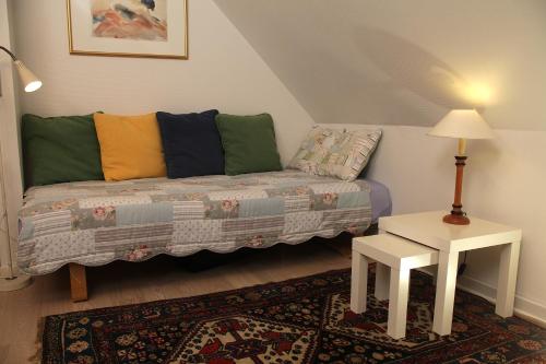 a living room with a couch and a table at Bed & Breakfast Horsens in Horsens
