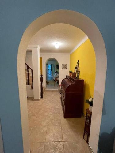 a hallway with an archway in a house at Casa 13 in Montargil
