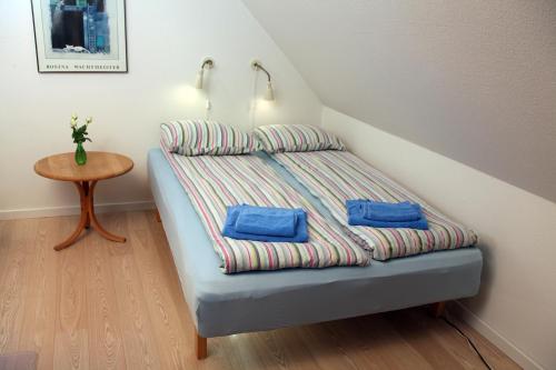 a bed with two pillows on it in a room at Bed & Breakfast Horsens in Horsens