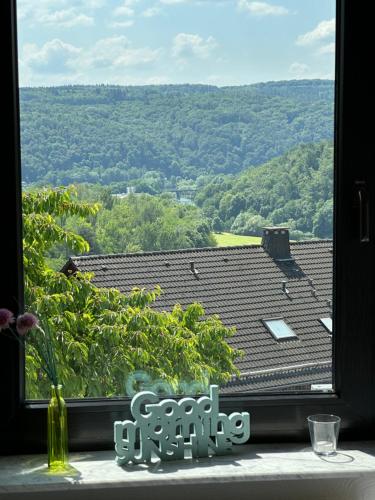 a window with a view of a roof at Heidrun's Home in Altendiez