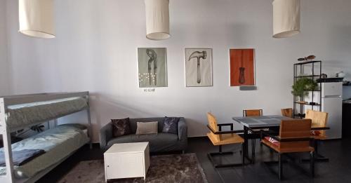 a living room with a couch and a table at Studio apartman Ada in Samobor