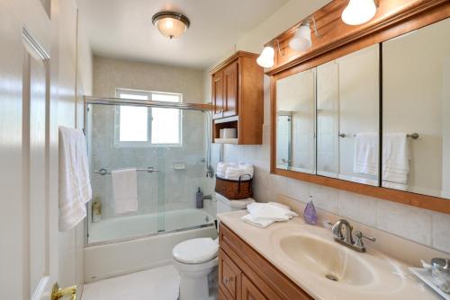 a bathroom with a sink and a shower and a toilet at Charming San Jose Home with Covered Patio and Backyard in San Jose