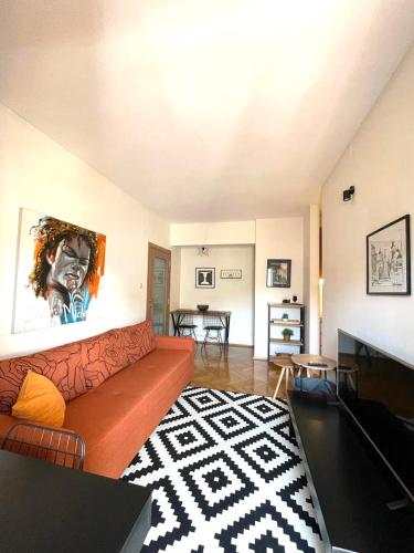 a living room with a couch and a table at Apartman Filip in Podgorica
