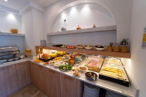 a buffet line with many different types of food at Hotel Club-E in Fethiye