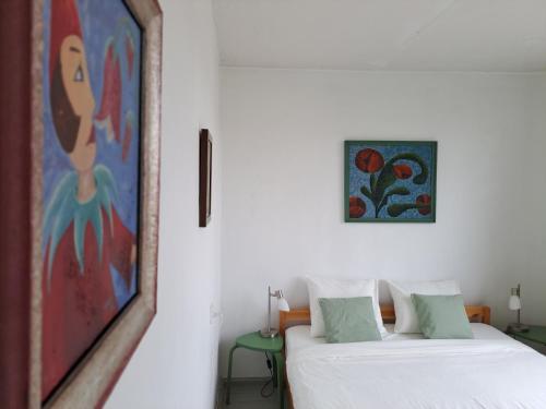 Postel nebo postele na pokoji v ubytování Butas Anykščiuose šeimoms