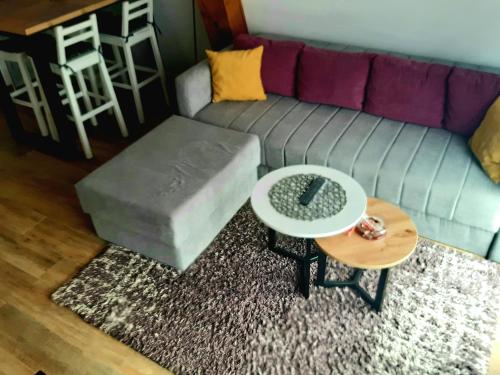 a living room with a couch and a table at White Eagle Kopaonik - Beli Orao in Kopaonik