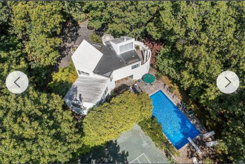 an overhead view of a house and a swimming pool at Rosemorran Retreat in Sag Harbor
