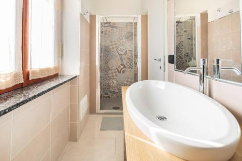 a bathroom with a white sink and a shower at Villa Picarielli in Salerno