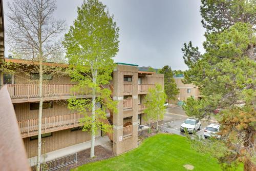 an aerial view of a apartment building with a yard at Frisco Condo with Pool Access Walk to Main Street! in Frisco