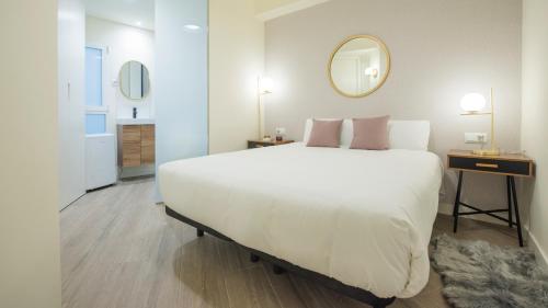 מיטה או מיטות בחדר ב-Apartamento Comercio 37 by Toledo AP