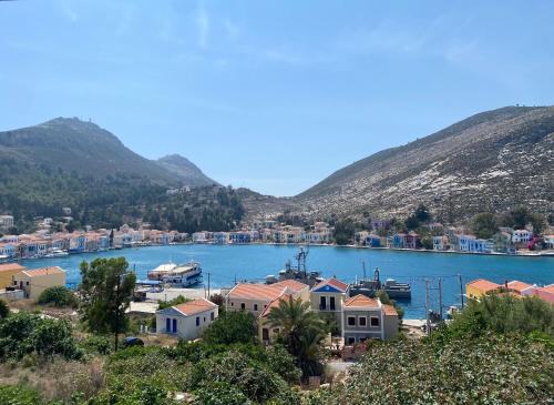 a view of a town and a body of water at To Petrino in Meyisti