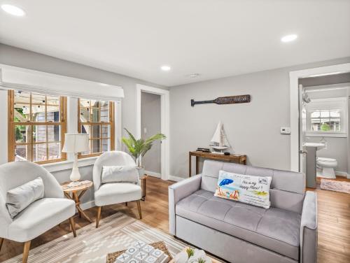 a living room with a couch and two chairs at Cape Cod Cottage, near Beach, Hot Tub, AC, Dog Friendly in Yarmouth