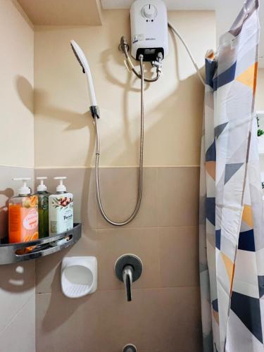 a shower with a shower head in a bathroom at * *K Irresistable value for 3 in Iloilo City