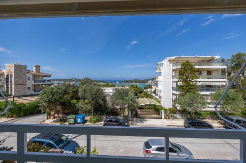 a view of a parking lot from a balcony at Beachside Bungalows in Athens