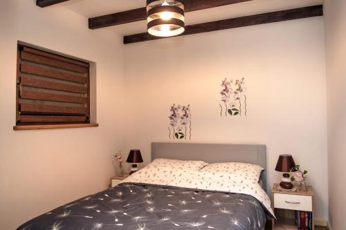 En eller flere senge i et værelse på Domek na wsi U Wiktora