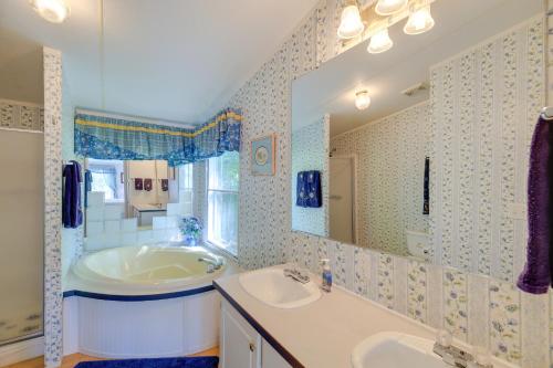 a bathroom with a tub and a sink and a tub at Serene Home 2 Decks, 3 Mi to Blue Ridge Pkwy in Willis