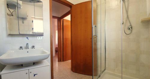 a bathroom with a sink and a shower at Casa Lucia in Cala Gonone