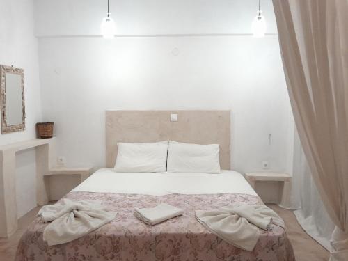 Ένα ή περισσότερα κρεβάτια σε δωμάτιο στο Sunset Suites 'Annada