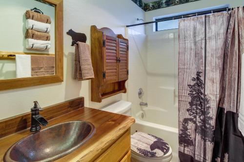 a bathroom with a sink and a shower at Scenic Arizona Cabin Rental Near Show Low Lake! in Show Low