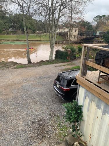 a car parked in front of a flooded street at Chateau Royale, Pet Friendly, On Bayou, Downtown! in New Iberia