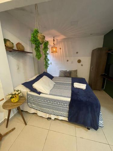 a bedroom with a large bed in a room at Residencial Temporada Aracaju in Aracaju