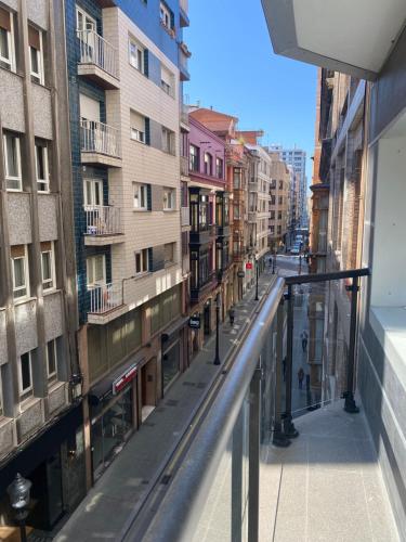 a view of a street from a balcony of a building at CENTRO GIJON CABRALES 31 in Gijón