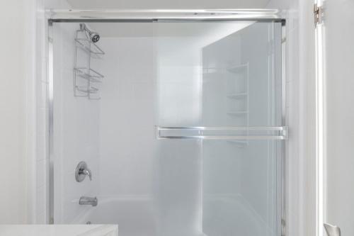 a shower with a glass door in a bathroom at South Beach 1br w pool gym lounge nr dining SFO-1405 in San Francisco