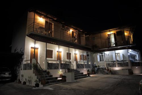 a building at night with lights on it at Petros Giatras - Rooms in Zakynthos Town