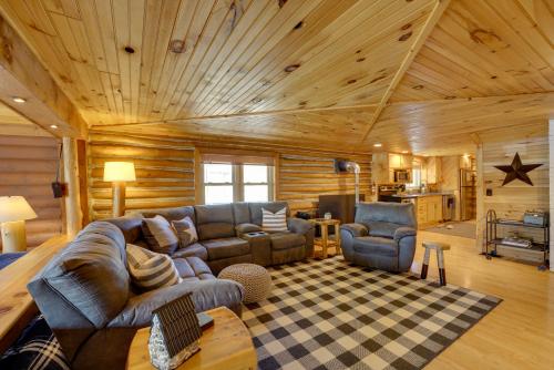 a living room with a couch and chairs in a cabin at Diamond Lake Waterfront Cabin with Deck and Dock! in Tustin