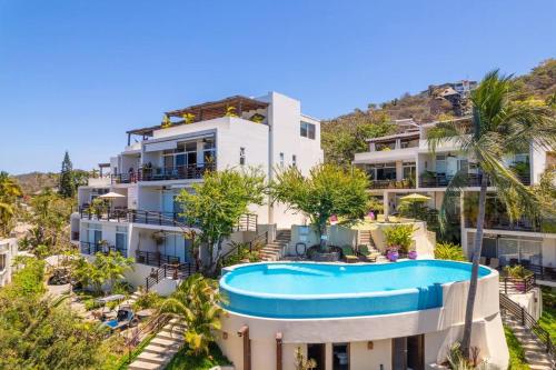 an image of a villa with a swimming pool at Casa Chaparra - Monterosa in Sayulita